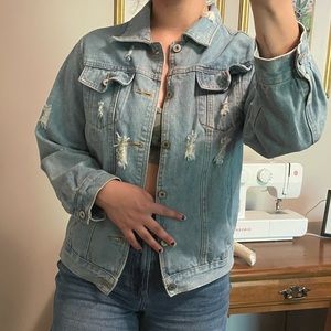 Distressed light wash jean jacket